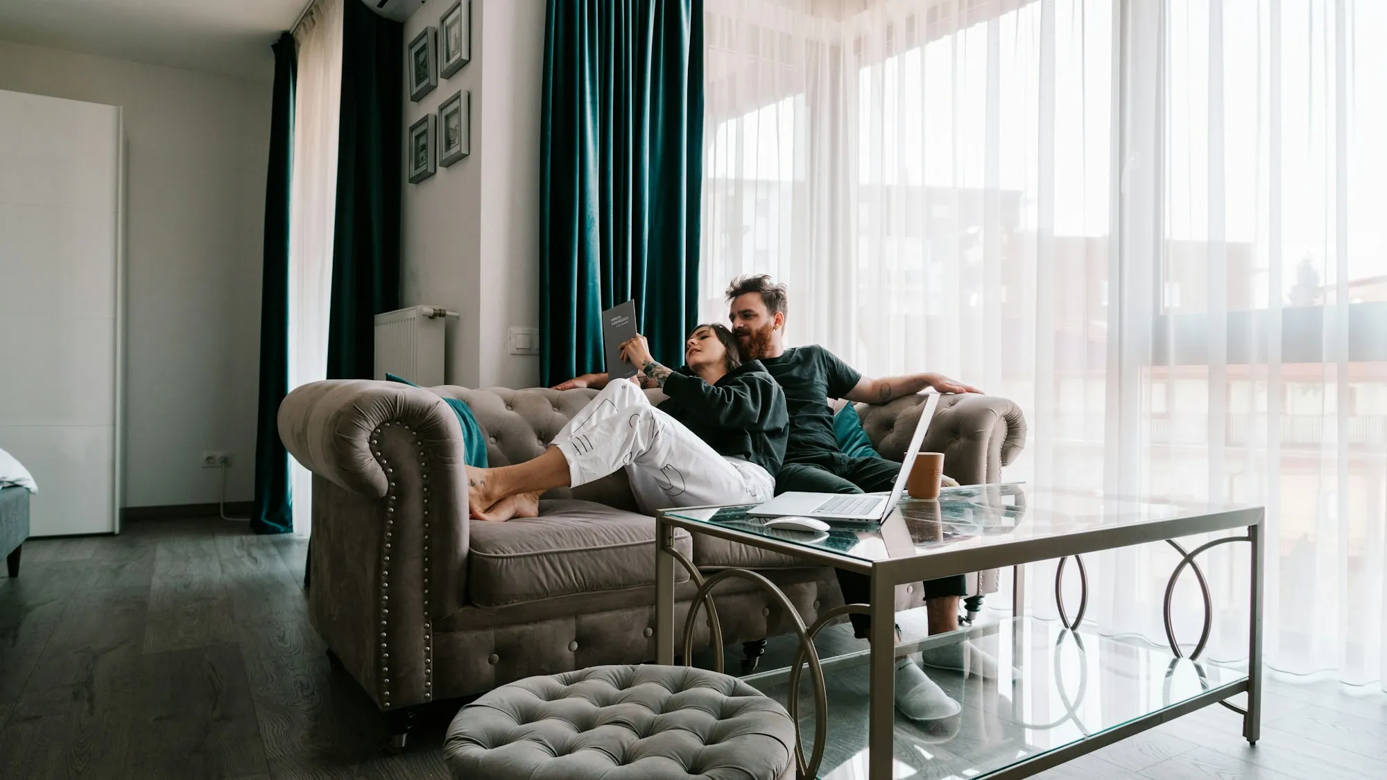 Couple relaxing together on a sofa in a bright living room